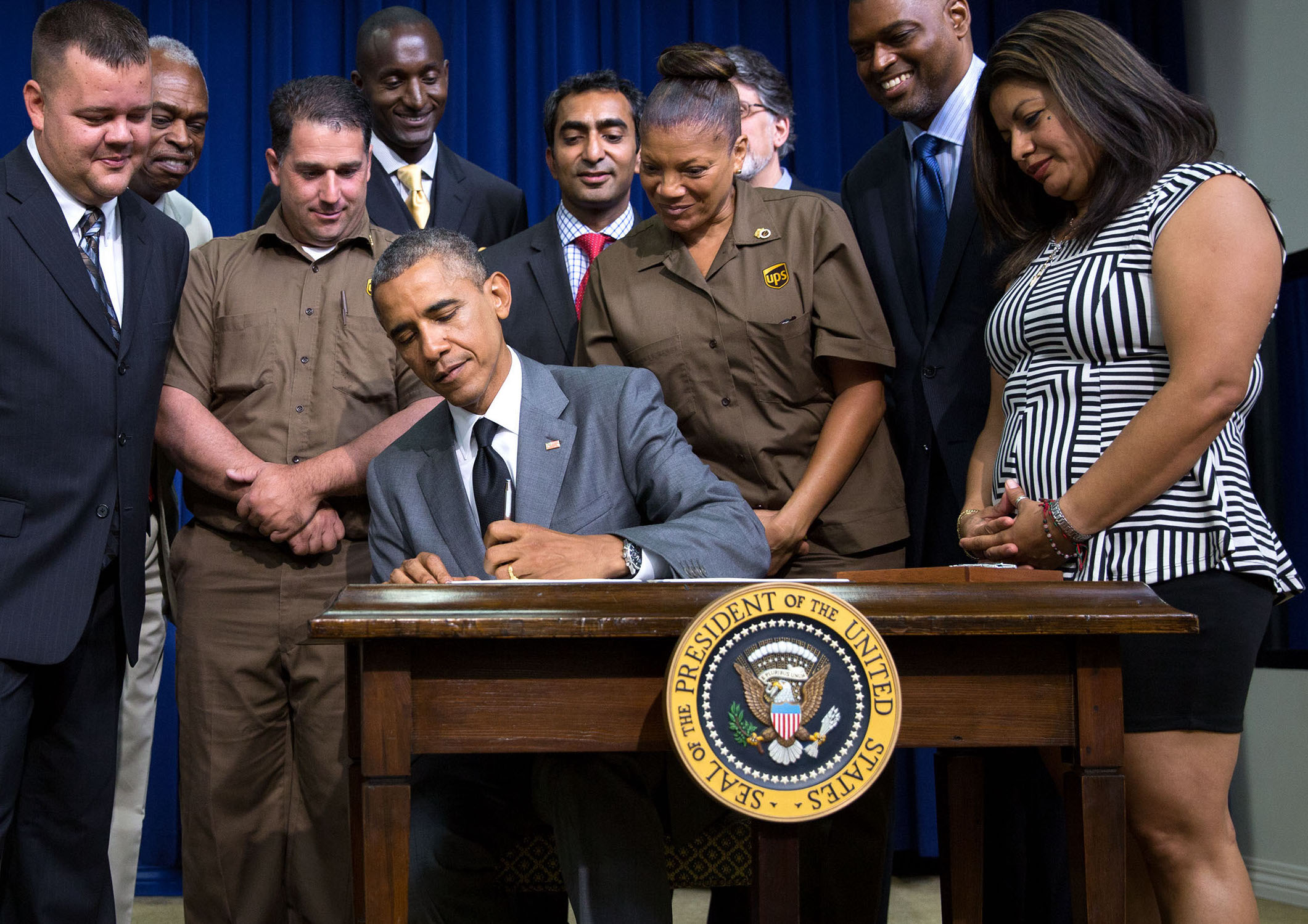 Photo of President Obama signing Fair Place and Safe Workplaces Executive Order