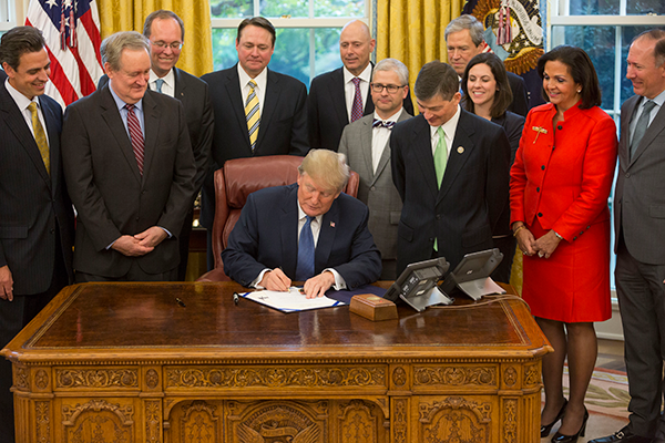 Photo of President Trump signing congressional disapproval of consumer arbitration regulation